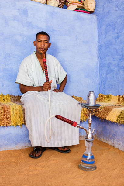 istock Nubian man smoking waterpipe in Southern Egypt 1213429826