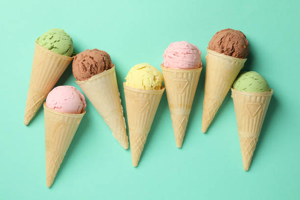 istock Ice cream in waffles on mint background. Sweet food 1213432603