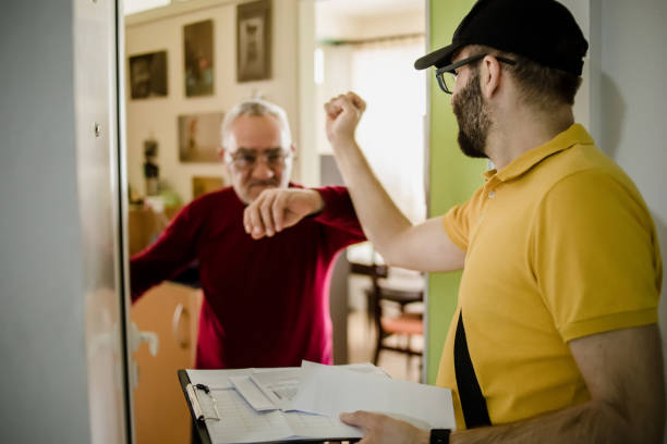 istock The postman brings the post to an older man 1213432767