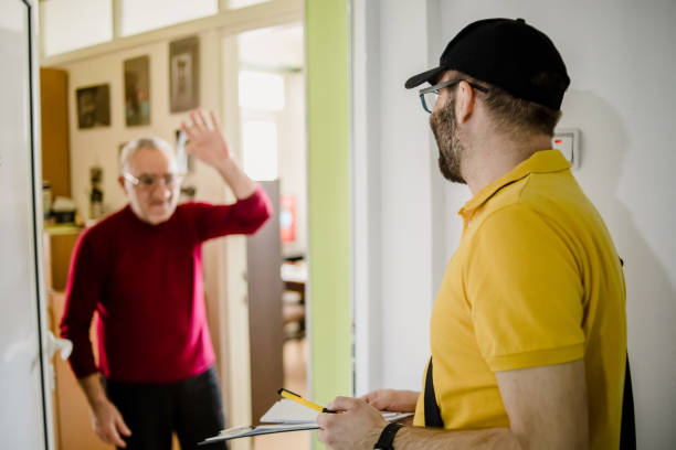 istock The postman brings the post to an older man 1213432808