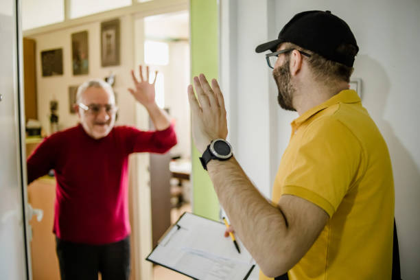 istock The postman brings the post to an older man 1213432826