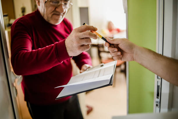 istock The postman brings the post to an older man 1213432863