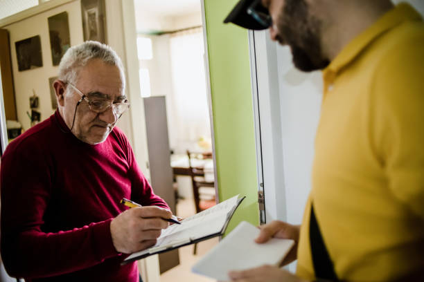istock The postman brings the post to an older man 1213432932
