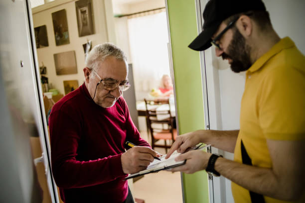 istock The postman brings the post to an older man 1213432954