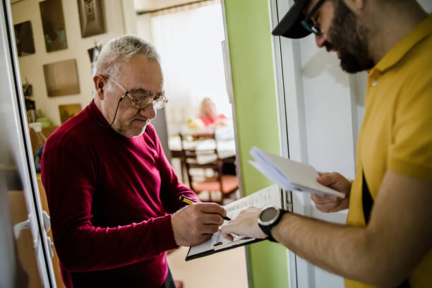 istock The postman brings the post to an older man 1213432994