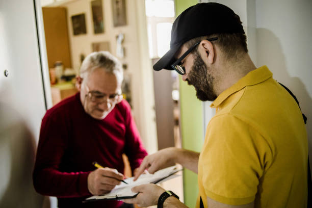 istock The postman brings the post to an older man 1213432995