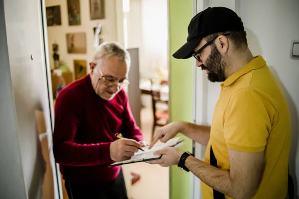 istock The postman brings the post to an older man 1213433004