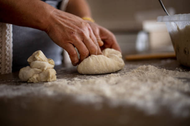 istock People knead the dough. 1213433879