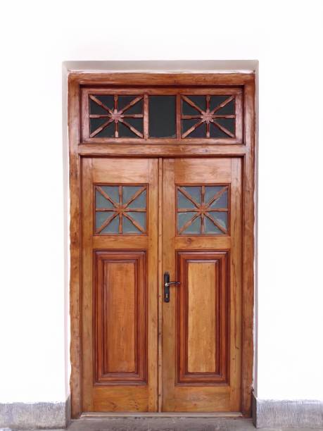 istock Old wooden door isolated on wall white background 1213434080