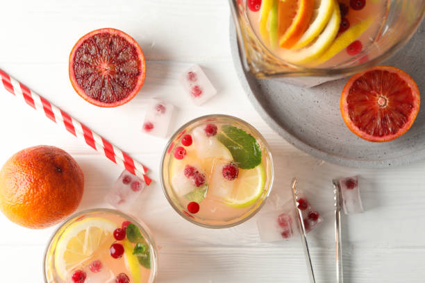 istock Lemonade with cranberry and lemon on wooden background, top view 1213434788