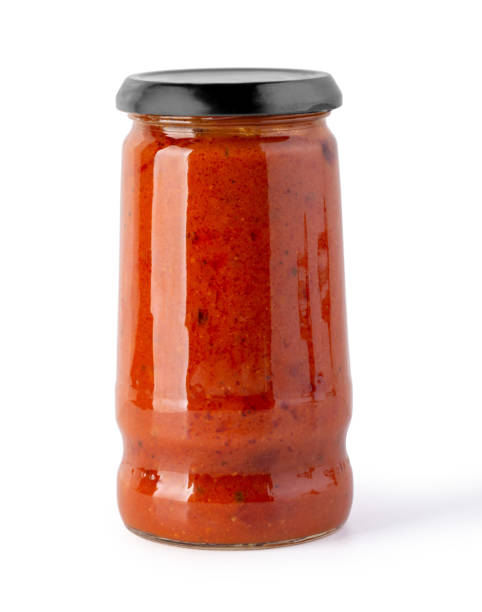 istock Tomato sauce jar on white background 1213434871