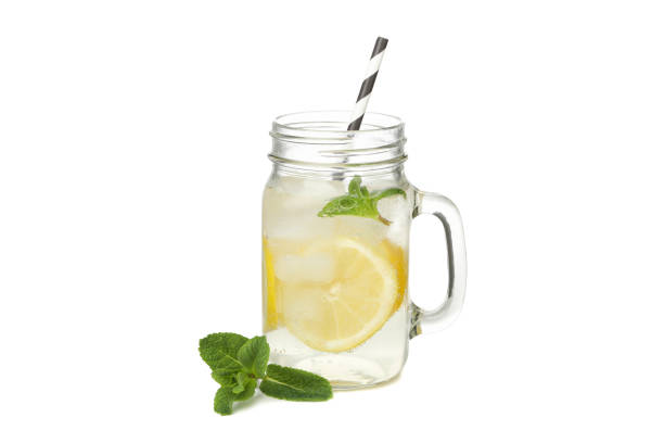 istock Glass jar of lemonade isolated on white background 1213435425