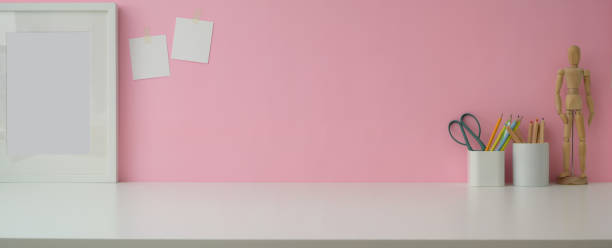 istock Close up view designer workspace with copy space, frame and designer supplies on marble table 1213436615