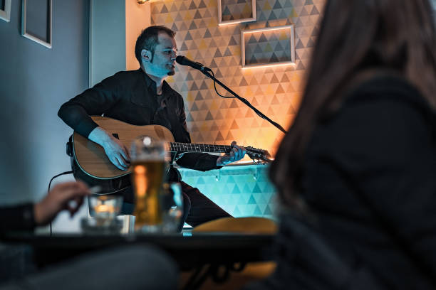 istock Man playing acoustic guitar 1213437524