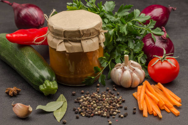 istock Canned squash spread in glass jar. Raw vegetables and spices 1213437960