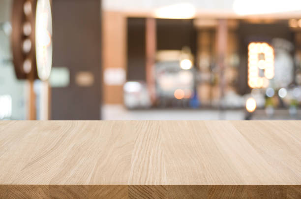 istock Table top and blur restaurant on background for product display 1213438929