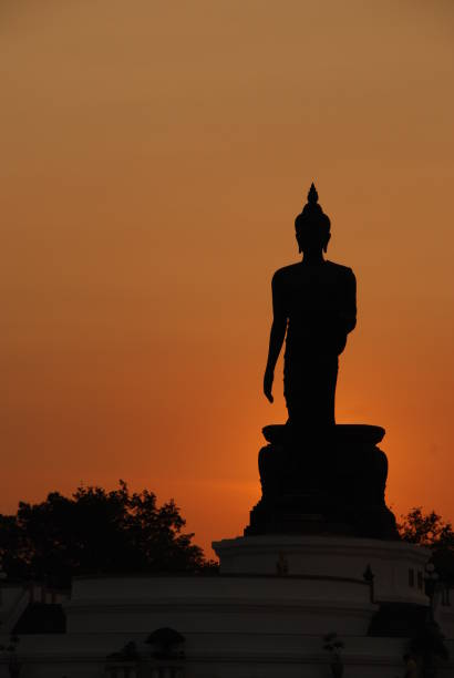 istock silhouette big buddha have orange sky background 1213440261