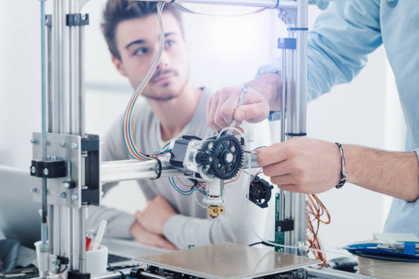 istock Young researchers and 3D printing 1213441964