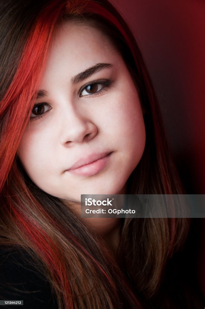 Teen girl with red highlights  Highlights - Hair Stock Photo