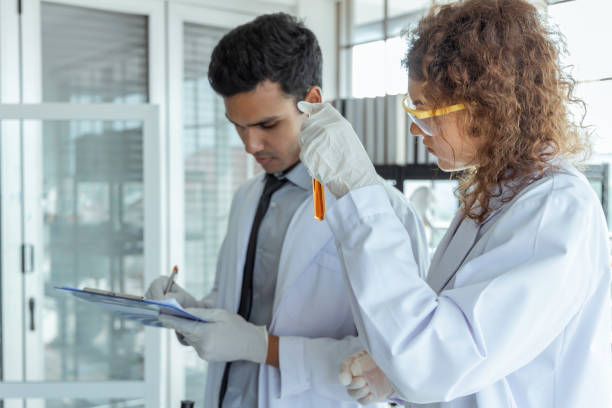 istock Two scientists working together in chemical laboratory. 1213450774