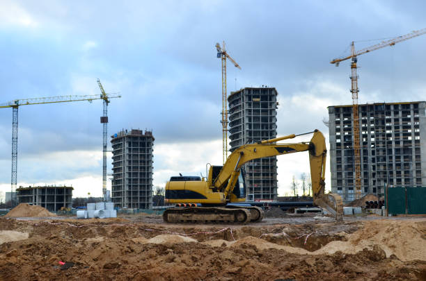istock Tracked excavator working at a construction site during laying or replacement of underground storm sewer pipes. Installation of water main, sanitary sewer, storm drain systemsduring - Image 1213451005