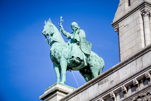 PARIS/FRANCE - September 6, 2019 : Knight bronze statue on the Basilica of Sacre Coeur