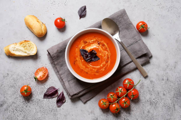 istock Tomato soup with cream and basil in a bowl 1213454479