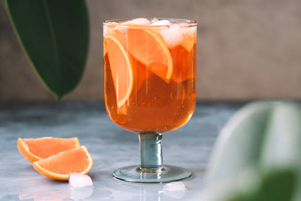 istock Spritz cocktail with oranges and ice in wine glass 1213454562