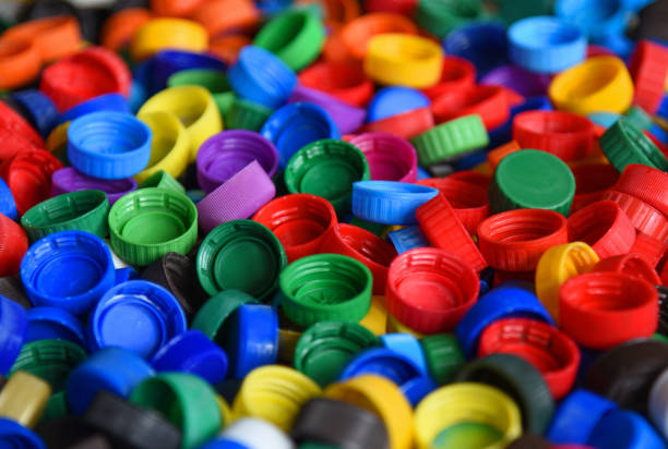 Plastic bottle caps background. Cap material is recyclable.Remove lids from plastic bottles before recycling them. Recycling collection and processing plastic bottle caps Plastic bottle caps background. Cap material is recyclable.Remove lids from plastic bottles before recycling them. Recycling collection and processing plastic bottle caps polypropylene stock pictures, royalty-free photos & images