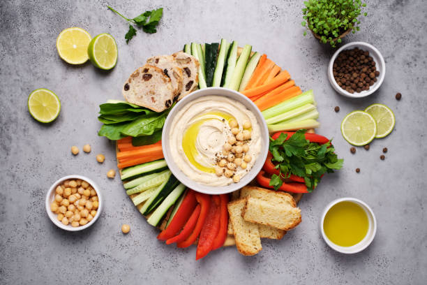 Hummus plate with a variety of vegetables and bread
