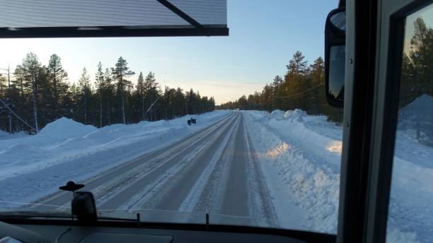 istock The snowy road seen during sunset from the bus 1213458783