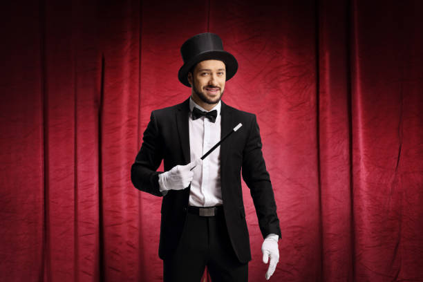 istock Magician performing a show on stage 1213459168