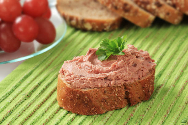 istock Slice of bread roll and liver pate 121346036