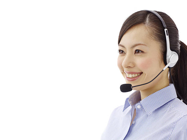 A woman phone operator in a shirt with a headset stock photo