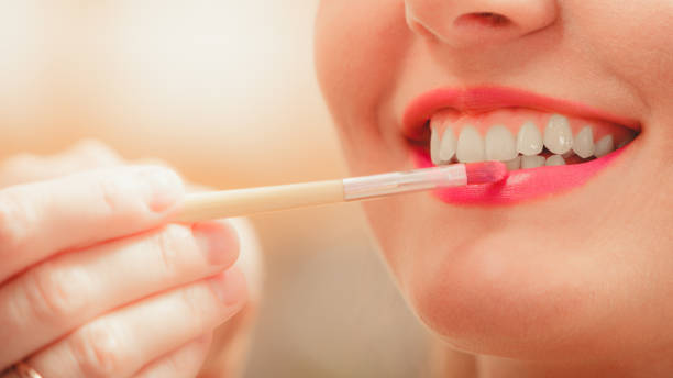 istock Make up artist applying lipstick with brush. 1213461943