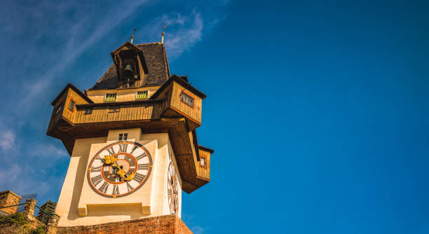 uhrturm landmark in graz cityscape view, styria region of austria - graz austria clock tower styria imagens e fotografias de stock