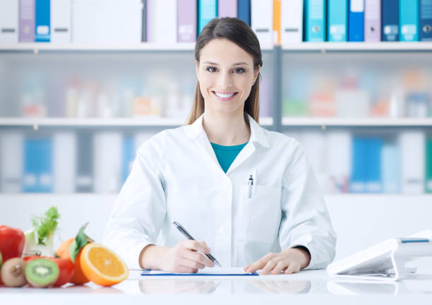 istock Nutritionist working at office desk 1213462710