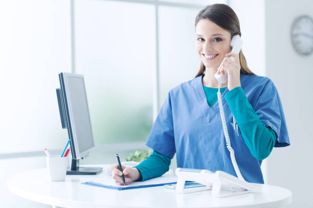 istock Female doctor at the reception desk 1213462803