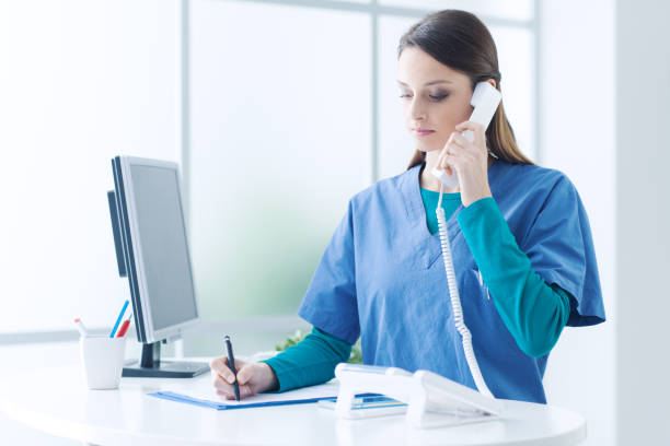 istock Female doctor at the reception desk 1213462890