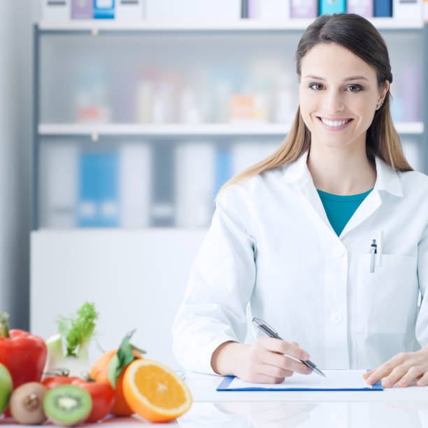 istock Nutritionist working at office desk 1213463060
