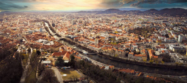 aerial panorama view from graz hill schlossberg in austria, cityscape with house roofs, mur river and all famous landscapes of tourist city. - graz austria clock tower styria imagens e fotografias de stock