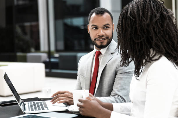istock Diverse positive colleagues discussing ideas 1213463787