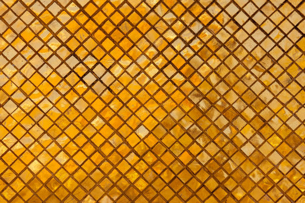 istock Ancient, reflective, gold, mosaic, tiny, square, tile background on a Thai religious historical building. 1213465596