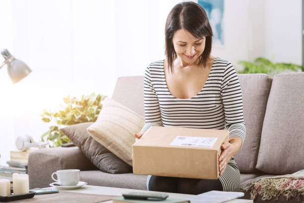 istock Woman receiving a parcel 1213466906