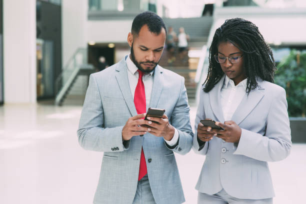 istock Focused diverse business people consulting internet 1213467392