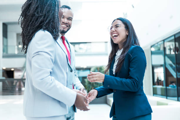 istock Joyful diverse business colleagues chatting 1213469123