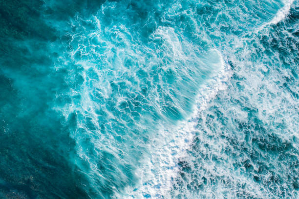 istock Big ocean waves hitting a coral rif. View from above. 1213469139