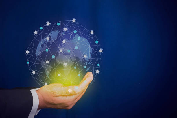 istock Businessman holding the world map with connecting dots in hands 1213470058