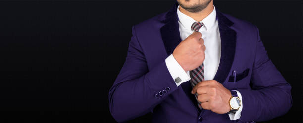 istock Professional businessman adjusting his necktie on banner template 1213470068
