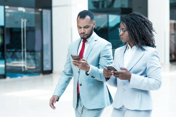 istock Confident diverse business colleagues consulting internet 1213470653